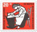 Stamp: Mutter mit Kind in einer Wiege